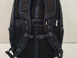 a black backpack that is sitting on a table