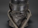an old helmet with a helmet on top of it