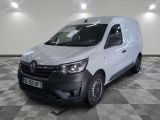 the white van is parked on a checkered floor in a room