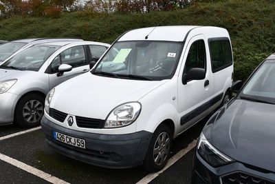 many cars that are parked in a parking lot