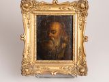 painting of a bearded man in a gold frame on a white background