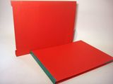a red folder with a green strip on top of it