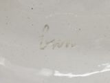 a close up of a white plate with writing on it