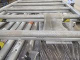 a metal rack with a bunch of different tools on it