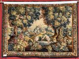 a tapestry hanging on a red wall with a picture of a woman and two animals