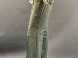 an image of a mannequin mannequin wearing a black top and green pants