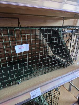 two cages that are on the shelf in the store