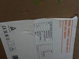 a box that has a laptop and a cell phone in it
