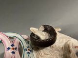 a figurine of a ram with a horn on its head