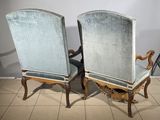 pair of antique chairs with upholstered back and arms