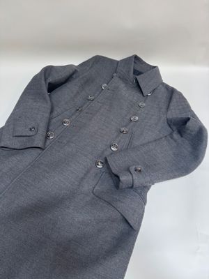 grey dress shirt with buttons on the chest and long sleeves