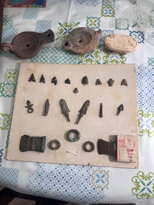 a wooden board with various tools on it on a table