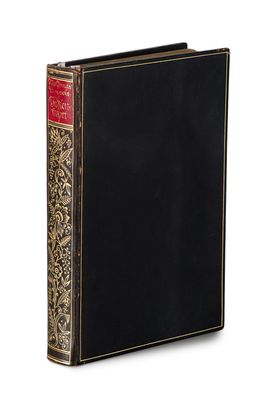 a black book with gold trim and a red cover