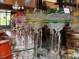 many glasses on a glass table in a store