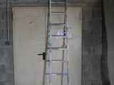 a ladder that is leaning against a wall in a room