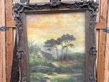 une photo représentant un tableau posé sur un chevalet devant un mur en bois