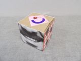 a box with a picture of a man with a smile on it