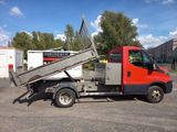 a red truck with a ramp on the back of it