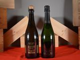 two bottles of wine sitting next to each other on a table