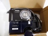 a box with a camera and a mouse inside of it