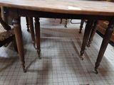 a table that has a lot of chairs around it