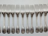 a lot of forks and spoons sitting on a table