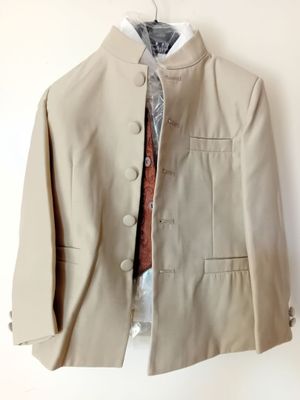 jacket on a hanger on a white wall with a red tie