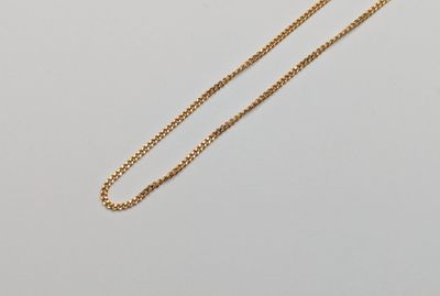 a gold necklace with a chain that is attached to it
