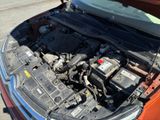a car that has its hood open with the engine in it