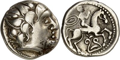 a close up of a coin with a horse on it