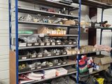 many shelves that have various items on them in the room