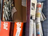 a box full of assorted items sitting on a shelf