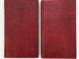 a pair of red books sitting on top of each other