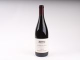 a bottle of wine that is sitting on a table