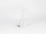 a glass sculpture of a bird on a white surface