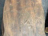 a wooden tray that has a design on it
