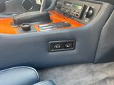 a car dashboard with a radio and a remote control in it