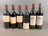 six bottles of wine are lined up in a row on a table
