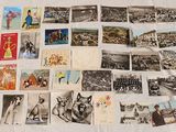 a lot of old postcards on the bed