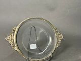 an image of a silver plate with a glass plate holder on it