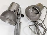 two lamps that are sitting on a white table