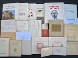 a lot of books that are sitting on a table