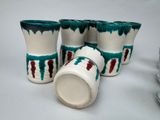 four cups that are sitting on a table
