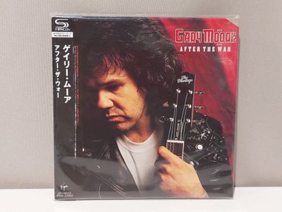 a cd with a picture of a man holding a guitar