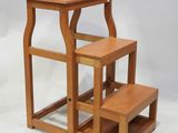 two step stools with a small table on top of them