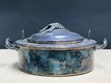 a pot with a lid sitting on a table