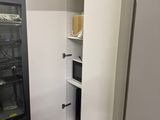 an image of a closet in a room with a computer on it