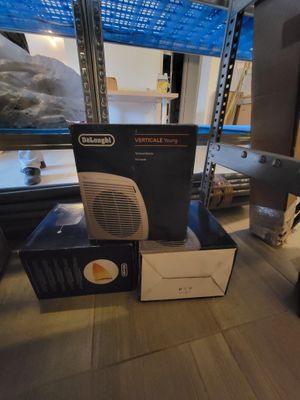 a box with a heater sitting on the floor next to a box with a heater on it