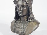 an antique bronze bust of a woman with long hair on a pedestal