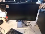 an image of a computer desk with a keyboard and monitor